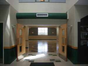 Open front foyer with french doors opening up to the main hall area.